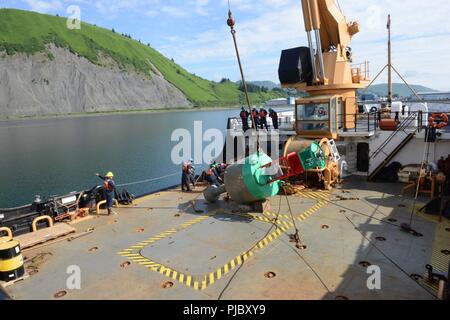 Coast Guard Cutter SPAR crew members conduct a buoy evolution on the buoy deck for training and qualification purposes in Kodiak, Alaska, July 17, 2018. The SPAR is responsible for maintaining 149 aids to navigation in Alaska and often partners with the National Oceanic and Atmospheric Administration to service and maintain critical weather buoys in the Bering Sea and Pacific Ocean. U.S. Coast Guard Stock Photo