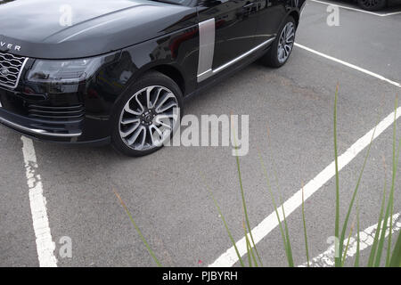 Range Rover Bad Parking in parking bay Stock Photo