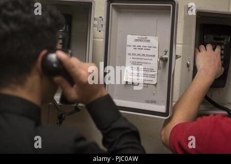 New U.S. Marine Corps recruits make a phone call home to inform family or friends that they arrived safely on Parris Island, S.C., for recruit training July 16, 2018. Each recruit will get in contact with either their next-of-kin, or their recruiter upon arrival on the depot. If they cannot contact either at the time, they will receive another chance later in training. The new recruits of Delta and Papa Company are scheduled to graduate Oct. 12, 2018. Parris Island has been the site of Marine Corps recruit training since Nov. 1, 1915. Today, approximately 19,000 recruits come to Parris Island  Stock Photo