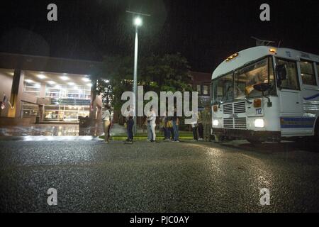 New U.S. Marine Corps recruits step off the bus after arriving on Parris Island, S.C., for recruit training July 16, 2018. These young men and women are scheduled to begin their training in the next few days with Delta Company, 1st Recruit Training Battalion, and Papa Company, 4th Recruit Training Battalion. Delta and Papa Company are scheduled to graduate Oct. 12, 2018. Parris Island has been the site of Marine Corps recruit training since Nov. 1, 1915. Today, approximately 19,000 recruits come to Parris Island annually for the chance to become United States Marines by enduring 12 weeks of ri Stock Photo