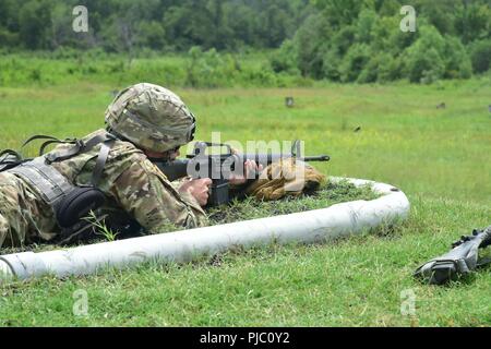 In this image, released by the U.S. Army Reserve, Soldiers with the 420th Engineer Brigade conduct weapons qualification training during River Assault 2018 at Fort Chaffee, Arkansas, July 18, 2018. The exercise stresses the warrior and engineer skills of the troops as they engage two weeks of training in weapons familiarity, security, and wet gap crossing in a tactical environment. Stock Photo