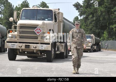 A U.S. Army Reserve soldier with the 369th Chemical Company collects a ...