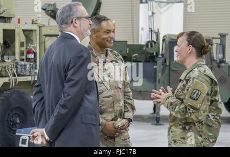 U.S. Army  Brig Gen. Nikki L. Griffin Olive, 335th Signal Command (Theater) (Provisional) commander speaks with  U.S. Army Lt. Gen. Michael X. Garrett, U.S. Army Central commanding general and Ambassador Lawrence R. Silverman, Ambassador of the United States of America to the State of Kuwait following her assumption of command during the 335th Signal Command (T) (P) change of command ceremony at Camp Arifjan, Kuwait, July 19, 2018. The 335th SC (T) (P) is headquartered in Camp Arifjan and provides communication services to coalition and joint forces located at over 30 sites in 11 countries thr Stock Photo