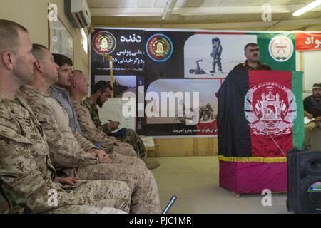 HELMAND PROVINCE, Afghanistan (July 14, 2018) - U.S. Marine Corps advisors with Task Force Southwest attend a non-commissioned officer (NCO) leadership course opening ceremony at Camp Shorabak. The ANA NCOs will participate in a three-week-long leadership course designed to develop small-unit leadership skills. Stock Photo