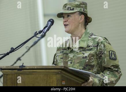 Incoming 335th Signal Command (Theater) (Provisional) commander U.S. Army Brig. Gen. Nikki L. Griffin Olive delivers her incoming remarks at the 335th SC (T) (P) change of command ceremony at Camp Arifjan, Kuwait, July 19, 2018. The 335th SC (T) (P) will continue to provide essential means of communication to maintain USARCENT’s interests and the continued stability of the region. Stock Photo