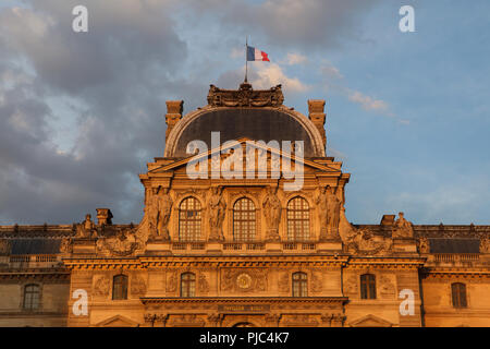 Pavillon Sully, also known as the Clock Pavilion (Pavillon de l’Horloge) of the Louvre Palace (Palais du Louvre) in Paris, France, at sunset. Stock Photo