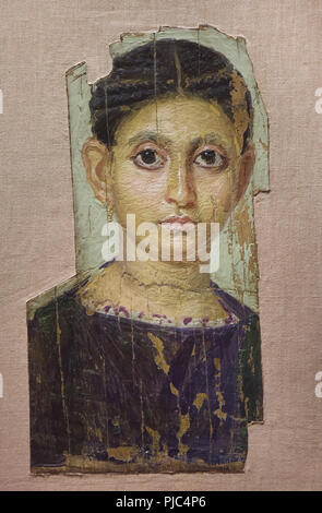 Female mummy portrait of the Fayum type from Antinopolis dated from 130-150 AD on display in the Louvre Museum in Paris, France. Stock Photo