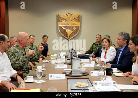 U.S. Navy Adm. Kurt Tidd, commander of U.S. Southern Command (SOUTHCOM), talks with Colombian President-elect Ivan Duque during a roundtable meeting with other command leaders at the military headquarters in Doral, Fla., July 14. Duque visited SOUTHCOM to learn more about the U.S. military command and its defense partnership with Colombia, as he prepares to assume the presidency of his country Aug. 7. SOUTHCOM expressed its desire to continue its successful partnership with the Colombian armed forces and collaboration towards increasing security and stability in the region. Stock Photo