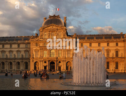 Pavillon Sully, also known as the Clock Pavilion (Pavillon de l’Horloge) of the Louvre Palace (Palais du Louvre) in Paris, France, at sunset. Stock Photo