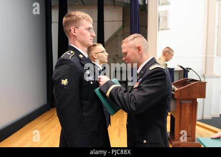 FORT GEORGE G. MEADE, Md. – Spc. Grant Ward, a cybersecurity specialist from Southbury, Connecticut, assigned to the 781st Military Intelligence (MI) Battalion, 780th MI Brigade, was the 2018 Tool Developers Qualification Course distinguished honor graduate and received an Army Achievement Medal at a graduation ceremony in the post theater July 13. Stock Photo