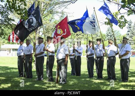 N.D. (July 23, 2018) - Members of the Veterans of Foreign Wars (VFW), Post 762, Fargo, parade the colors and the flags of each military branch during a wreath-laying ceremony honoring members of the Gato-class submarine USS Robalo (SS 273) during Fargo-Moorhead Metro Navy Week. The Navy Office of Community Outreach uses the Navy Week program to bring Navy Sailors, equipment and displays to approximately 14 American cities each year for a week-long schedule of outreach engagements designed for Americans to experience first hand how the U.S. Navy is the Navy the nation needs. Stock Photo