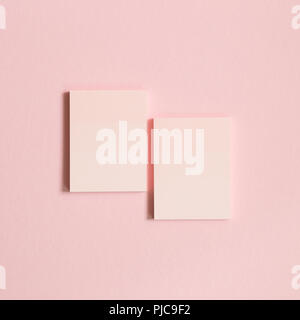 Pink memo pad, sticky notes on pink background Stock Photo