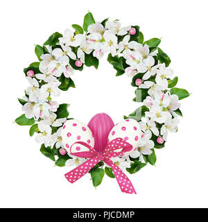 Round wreath with apple tree flowers and Easter eggs isolated on white background. Stock Photo