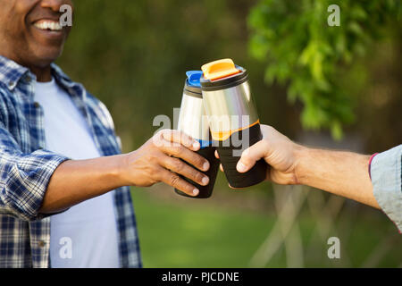 Diverse group of friends talking and laughing. Stock Photo