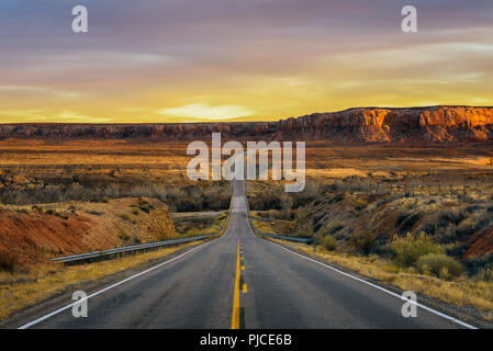 Sunset over an empty road in Utah Stock Photo