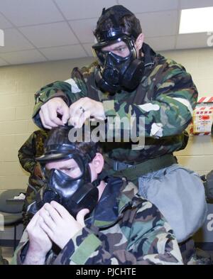 Members from the 117th Air Refueling Wing participate in Ability to Survive and Operate training at Sumpter Smith Air National Guard Base, Birmingham, Ala., July 22, 2018.  The training gives Airmen the skillset to defend themselves against chemical, biological, nuclear and radiological attacks and operate in environments with agents present. Stock Photo