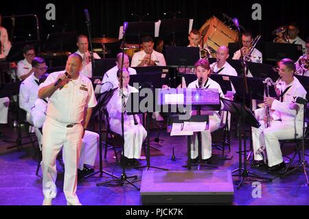 N.D. (July 23, 2018) - Chief Musician Tommy Horner, a native of Pittsburgh and a member of Navy Band Great Lakes, sings during a concert at the Fargo Theatre during Fargo-Moorhead Metro Navy Week. The Navy Office of Community Outreach uses the Navy Week program to bring Navy Sailors, equipment and displays to approximately 14 American cities each year for a week-long schedule of outreach engagements designed for Americans to experience first hand how the U.S. Navy is the Navy the nation needs. Stock Photo