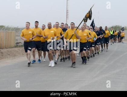 CAMP LEMONNIER, Djibouti – Sailors forward deployed here participate in an early-morning group run as part of Chief Petty Officer 365 (CPO 365) training, July 10, 2018. The organization invited junior Sailors and other service members assigned to Camp Lemonnier and Combined Joint Task Force-Horn of Africa, to participate in the run, introducing them to the Navy’s new leadership training program, Sailor 360. Stock Photo