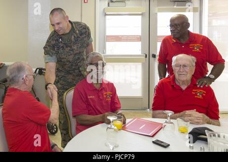 Colonel Craig Clemans, incoming Marine Corps Logistics Base Barstow Commander, introduces himself to members of Veterans of Foreign Wars Post 12039 during the Quarterly Awards Breakfast aboard MCLB Barstow, Calif., July 17. Stock Photo