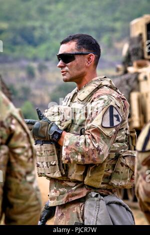 Capt. Nicholas Spicocchi, commander of Alpha Company, 2nd Battalion, 5th Cavalry Regiment, 1st Armored Brigade Combat Team, 1st Cavalry Division provides his troops with feedback during the after action report of a section live fire exercise, Selo Training Area, Bulgaria, July 24, 2018.  This training is in support of Atlantic Resolve, an enduring training exercise between NATO and U.S. Forces. Stock Photo