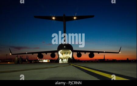 A C-17 is being prepared to take off the flight at Green Ramp in Fort Bragg, North Carolina, July 19, 2018. A C-17 is a common used aircraft by paratroopers when they do airborne jumps. Stock Photo