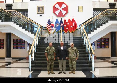 From left to right: Marine Corps Sgt. Maj. Anthony Spadaro, command senior enlisted leader, U.S. Indo-Pacific Command, retired Army Col. Trey Johnson, U.S. Army Pacific Project Greenbook lead and Eighth Army Command Sgt. Maj. Richard E. Merritt meet at the Eighth Army headquarters at Camp Humphreys, South Korea, July 10, 2018. Spadaro and Johnson visited Camp Humphreys to talk about the U.S. Army Pacific’s Project Greenbook, a training initiative designed to develop more resilient, adaptive and innovative Soldiers and leaders. Stock Photo