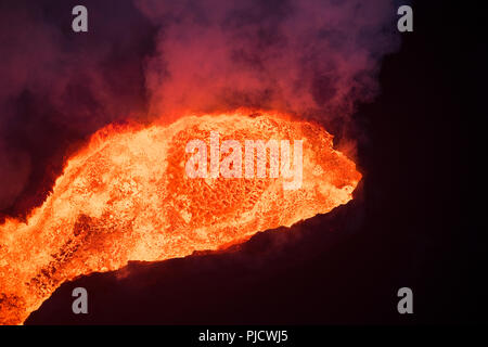 A view of the lava cinder cone in the middle of a lava flow at the ...