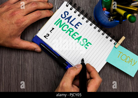 Conceptual hand writing showing Sale Increase. Business photo showcasing Average Sales Volume has Grown Boost Income from Leads Man holding marker not Stock Photo