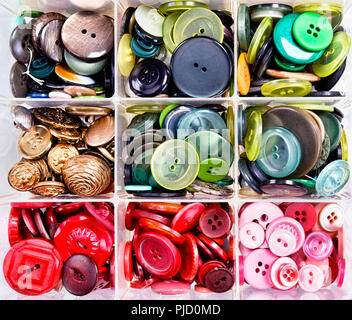A variety of colourful buttons in bins. Stock Photo