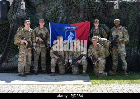 VICENZA, Italy -- U.S. Army Paratroopers assigned to 2nd Battalion (Airborne), 503rd Infantry Regiment 'The Rock', 173rd Airborne Brigade pose for a team photo after winning 1st place in the Running of the Herd 24 hour relay race on July 18th, 2018. The Running of the Herd is an annual 173rd Airborne Brigade event honoring fallen Paratroopers. Competitors must complete as many laps as possible around Caserma Del Din's 2.3 mile perimeter road before time runs out. This team completed 50 laps in 24 hours, rucking approximately 115 miles. The 173rd Airborne Brigade is the U.S. Army’s Contingency  Stock Photo