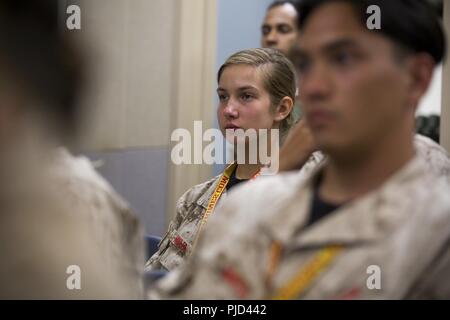 Beth Miller, a student at Blessed Trinity Catholic High School in Roswell, Georgia, listens to Sgt. Maj. Robin C. Fortner, the Marine Corps Systems Command sergeant major, speak about leadership and mentorship during Marine Corps Recruiting Command’s 2018 Summer Leadership and Character Development Academy aboard Marine Corps Base Quantico, Virginia, July 18. Approximately 200 students were accepted into the academy, hand-selected by a board of Marines who look to find attendees with similar character traits as Marines. Inspired by the Marine Corps' third promise of developing quality citizens Stock Photo