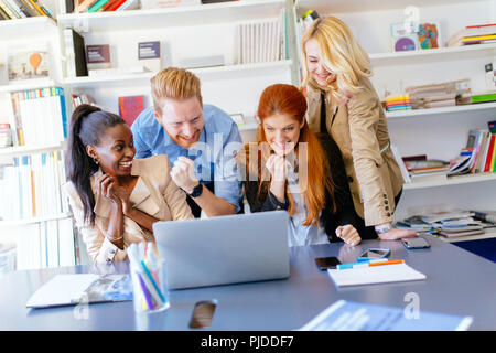 Happy business coworkers celebrating Stock Photo