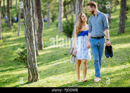 Beautiful couple in forest embracing love Stock Photo