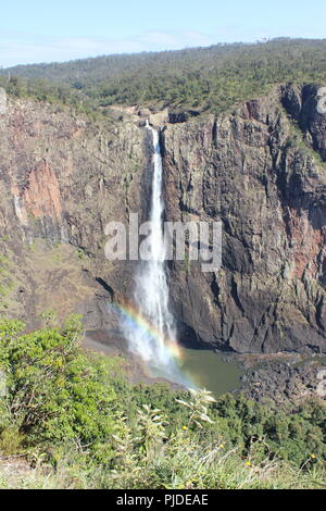 Australia's tallest waterfall- Wallaman falls in Queensland. It stands 286m high, and in the middle of the day, a near-360 degree rainbow is visible. Stock Photo