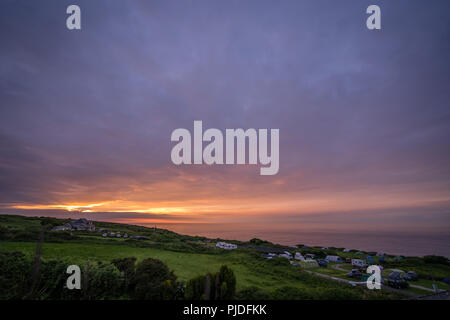 St. Ives, England -  May 2018 : Beautiful colorful sunset over the campground on the Cornish coast, Cornwall,  UK Stock Photo