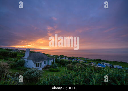 St. Ives, England -  May 2018 : Beautiful colorful sunset over the campground on the Cornish coast, Cornwall,  UK Stock Photo