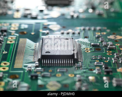 Electronic chip and components on a circuit board Stock Photo