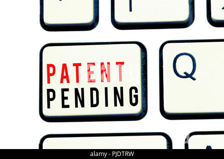 Writing note showing Patent Pending. Business photo showcasing Request already filed but not yet granted Pursuing protection. Stock Photo