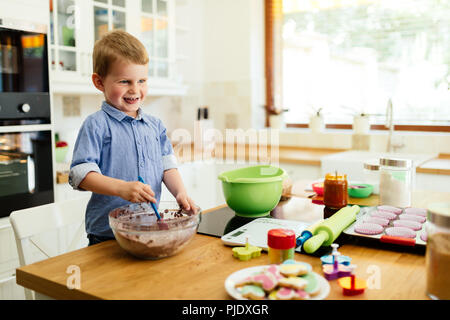 Cute child learning to become a chef Stock Photo