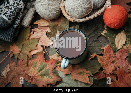 Knitting threads in a park on leaves Stock Photo