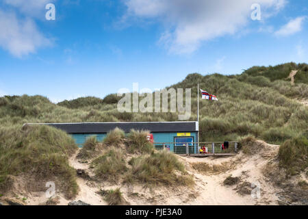 The RNLI Lifeguard hut in the dunes at Crantock Beach in Newquay Cornwall. Stock Photo