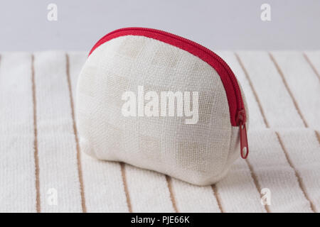 handmade fabric coins purse on white cloth background Stock Photo