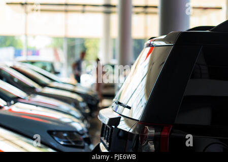 Interior of car dealer showroom with new cars Stock Photo