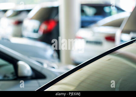 Interior of car dealer showroom with new cars Stock Photo