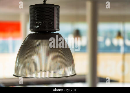 Modern lamp shade on office ceiling close Stock Photo