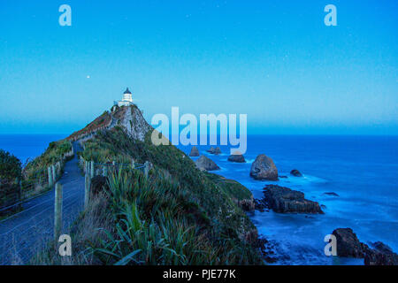 Famous Lighthouse Nugget Point at the wild Catlins Coast in New Zealand, South Island, Pacific Ocean Stock Photo