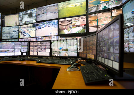 The control room of the city surveillance center. Computer monitors showing the cameras all over the city. Stock Photo