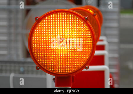 Amber beacon flashing lights for road works safety Stock Photo