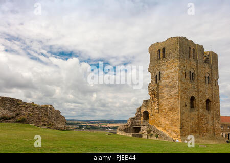 Dramatic cliff side landscape with Scarborough Castle in North Yorkshire. Stock Photo