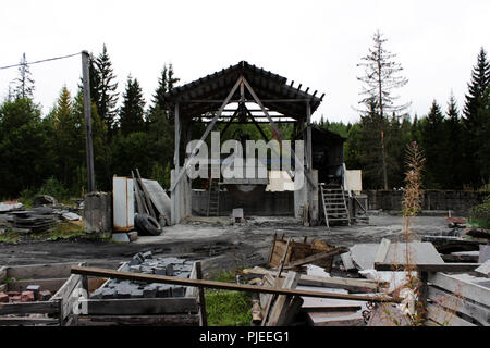 A large machine with a circular saw for cutting huge marble blanks and stones for making slabs next to the canyon. Industrial blanks of marble and stone. Circular Saw. Stock Photo